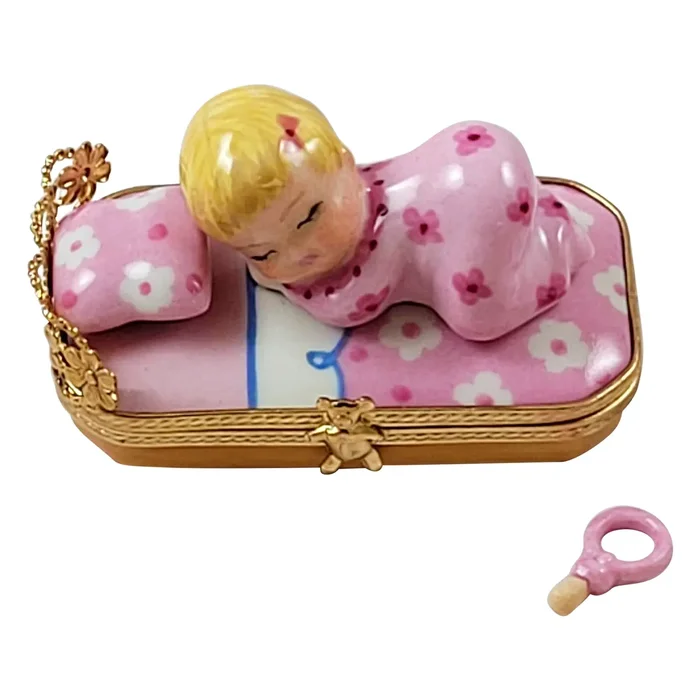 Baby In Pink Bed With Pacifier