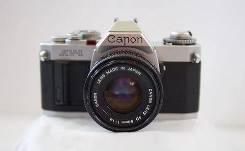 Canon AV-1 35mm SLR Camera with Canon FD Mount Lens, uses both Color & B&W 35MM film. (Renewed)