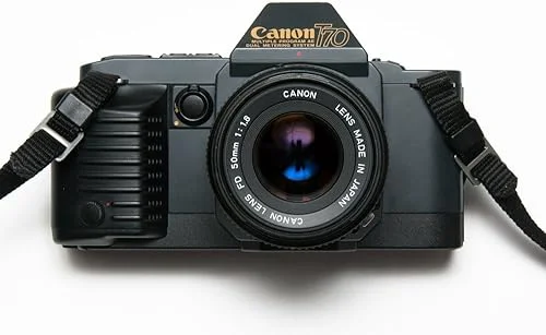 Canon T70 35MM SLR Film Camera kit With FD mount Zoom Lens Works with Color and B&W film. (Renewed)